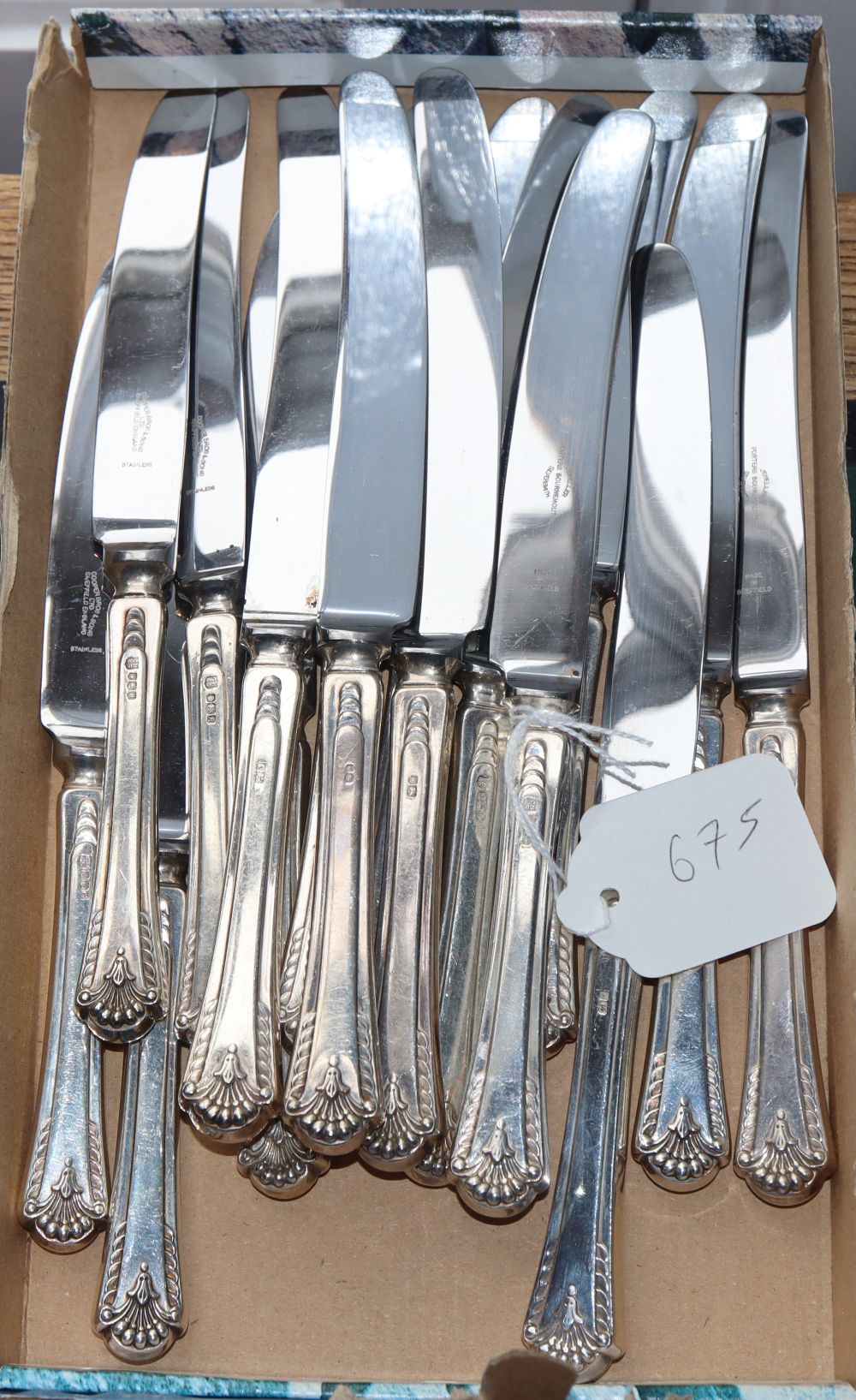 A set of eight modern silver handled table knives and eight dessert knives,